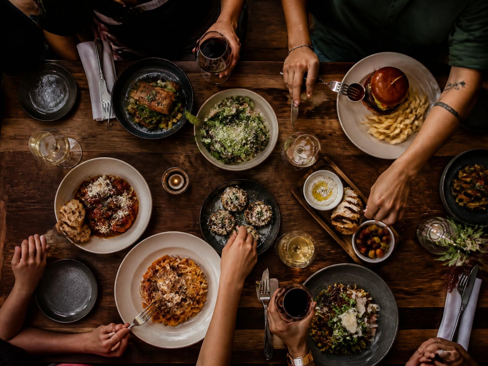 Restaurant table full of shared plates